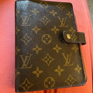 Louis Vuitton planner/wallet.
